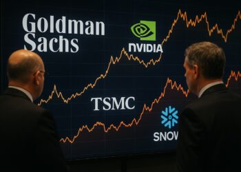 Ejecutivos de Goldman Sachs observan pantalla con gráficas financieras y logos de Nvidia, TSMC y Snowflake en sala de juntas profesional