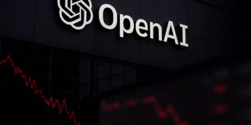 Logo de OpenAI iluminado en fachada con líneas rojas descendentes reflejadas en vidrio