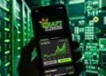 Smartphone mostrando app de DraftKings con predicciones y gráficos cripto