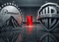 Logos gigantes de Paramount y Warner Bros. enfrentados por el logo de Netflix.