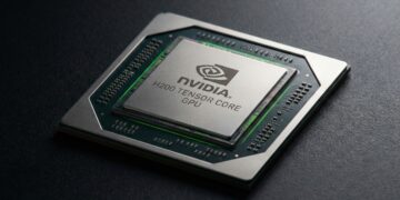 Fotografía macro de alta resolución de un procesador avanzado de inteligencia artificial. La imagen muestra el chip Nvidia H200 descansando sobre una superficie oscura y texturizada. En el difusor térmico metálico central, están grabados con precisión el logotipo del ojo de NVIDIA y el texto "NVIDIA H200 TENSOR CORE GPU". El sustrato del circuito verde y los pequeños condensadores que rodean el troquel central son claramente visibles bajo una iluminación lateral dramática.