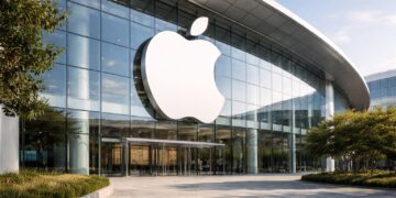 Logo de Apple integrado en edificio corporativo de gran escala.