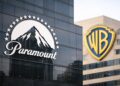 Logotipos de Paramount y Warner Bros en fachadas.