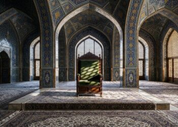 Un trono vacío de terciopelo verde en el centro de una majestuosa sala de arquitectura islámica con intrincados mosaicos azules y dorados.