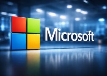 Logo de Microsoft en entorno tecnológico con fondo desenfocado.