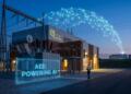 Subestación Ameren iluminada al anochecer con red digital conectada a centro de datos.